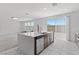 Bright kitchen features a large island with stainless steel appliances and tiled floors at 6955 Elysian Valley Ave, Las Vegas, NV 89113