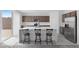 Modern kitchen features a large island, stainless steel appliances, and sliding doors at 6955 Elysian Valley Ave, Las Vegas, NV 89113