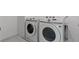 A laundry room featuring a front load washer and dryer ready for use at 6955 Elysian Valley Ave, Las Vegas, NV 89113