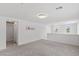 Spacious loft area with three windows, neutral walls and plush carpeting at 6955 Elysian Valley Ave, Las Vegas, NV 89113