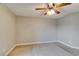 Spacious bedroom with a ceiling fan and carpet flooring at 698 S Racetrack Rd # 114, Henderson, NV 89015