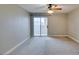 Bedroom featuring carpet and a sliding glass door to a patio at 698 S Racetrack Rd # 114, Henderson, NV 89015