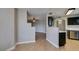 Dining area next to the kitchen featuring wood-look flooring and neutral paint at 698 S Racetrack Rd # 114, Henderson, NV 89015