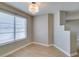 Dining area showcasing wood-look flooring, neutral walls, and a modern chandelier at 698 S Racetrack Rd # 114, Henderson, NV 89015