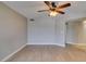 A spacious living room featuring an electric ceiling fan and light neutral walls at 698 S Racetrack Rd # 114, Henderson, NV 89015