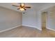 A spacious living room featuring an electric ceiling fan and light neutral walls at 698 S Racetrack Rd # 114, Henderson, NV 89015