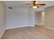 A spacious living room featuring an electric ceiling fan and light neutral walls at 698 S Racetrack Rd # 114, Henderson, NV 89015