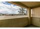 Outdoor patio with scenic neighborhood views under a partly cloudy sky at 698 S Racetrack Rd # 114, Henderson, NV 89015