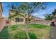 Spacious backyard with a pool, green lawn, and mature trees at 7035 Chestnut Valley St, Las Vegas, NV 89166