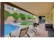Relaxing backyard view of a private pool, spa, covered patio, and lounge chairs for ultimate relaxation at 7035 Chestnut Valley St, Las Vegas, NV 89166