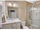 Modern bathroom features a vanity with a marble countertop and a glass-enclosed shower at 7035 Chestnut Valley St, Las Vegas, NV 89166