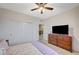 Cozy carpeted bedroom with a closet and dresser for ample storage and functionality at 7035 Chestnut Valley St, Las Vegas, NV 89166