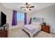 Bedroom with a window, ceiling fan, and comfortable decor at 7035 Chestnut Valley St, Las Vegas, NV 89166