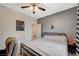 Bedroom showcasing a ceiling fan, carpeted floors, gray accent wall, and modern decor at 7035 Chestnut Valley St, Las Vegas, NV 89166