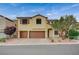 Two-story home featuring a terracotta-colored driveway and two-car garage at 7035 Chestnut Valley St, Las Vegas, NV 89166