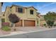 Two-story home featuring a terracotta-colored driveway and two-car garage at 7035 Chestnut Valley St, Las Vegas, NV 89166