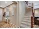 Hallway showcasing stairs with carpet and wood floors, and a side table with decor at 7035 Chestnut Valley St, Las Vegas, NV 89166