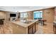 Open concept kitchen with granite counters overlooking the living room, ideal for entertaining at 7035 Chestnut Valley St, Las Vegas, NV 89166