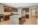 A lovely kitchen with an island and granite countertops at 7035 Chestnut Valley St, Las Vegas, NV 89166