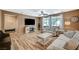 Comfortable living room with a fireplace and large windows providing natural light at 7035 Chestnut Valley St, Las Vegas, NV 89166