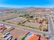 Wide aerial view featuring a large horse property with land, stables, and an arena at 728 N Kiel St, Henderson, NV 89015