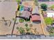 Beautiful horse property with a sparkling pool, lush landscaping, and circular driveway at 728 N Kiel St, Henderson, NV 89015