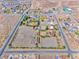 Aerial view showing the horse property, featuring its layout, horse areas, and residential buildings at 728 N Kiel St, Henderson, NV 89015