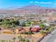 Custom home boasting a scenic view of mountains, horse property, and neighborhood at 728 N Kiel St, Henderson, NV 89015