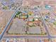 Aerial view of land, a pool, and potential equestrian facilities in a neighborhood at 728 N Kiel St, Henderson, NV 89015