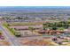 Wide-open lot in Nevada with horse stables and lush landscaping, and a glittering cityscape in the background at 728 N Kiel St, Henderson, NV 89015