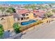 Horse property showcasing an outdoor pool, mature trees, and a covered patio at 728 N Kiel St, Henderson, NV 89015