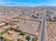 Aerial view of a large lot with equestrian facilities and beautiful desert mountain views at 728 N Kiel St, Henderson, NV 89015