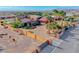 Beautiful estate featuring a circular driveway, horse property, desert landscape, and mature palms at 728 N Kiel St, Henderson, NV 89015