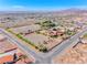 Aerial view showcases the entire horse property, including the house, stables, arena, and surrounding land at 728 N Kiel St, Henderson, NV 89015
