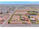 An aerial view of property featuring a pool, horse arena, and several structures at 728 N Kiel St, Henderson, NV 89015