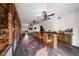 Stylish bar area with seating, wood accents, and ample space for entertaining guests at 728 N Kiel St, Henderson, NV 89015