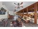 Spacious entertaining area with a bar, comfortable seating, and views of the outdoors at 728 N Kiel St, Henderson, NV 89015