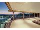 Large deck features a covered area with comfortable seating and an amazing view at 728 N Kiel St, Henderson, NV 89015