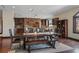 Spacious dining room features wooden floors, exposed brick, and modern lighting fixtures at 728 N Kiel St, Henderson, NV 89015
