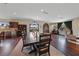 Spacious dining room features a large wooden table, hardwood floors, and ample natural light at 728 N Kiel St, Henderson, NV 89015