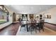 Open dining room concept boasts natural light, hard wood floors and stone fireplace at 728 N Kiel St, Henderson, NV 89015