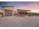 Exterior of the house with attached garage and covered patio, creating a welcoming outdoor space at 728 N Kiel St, Henderson, NV 89015