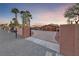 Stunning desert home featuring a long driveway, three-car garage and privacy gate at 728 N Kiel St, Henderson, NV 89015