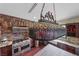 Kitchen features large island and decorative hanging lamp at 728 N Kiel St, Henderson, NV 89015