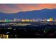 City skyline view featuring the lights of the Las Vegas hotels in the distance and a mountain range at 728 N Kiel St, Henderson, NV 89015