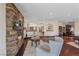 Comfortable living room featuring a stone fireplace, hardwood floors, and recessed lighting at 728 N Kiel St, Henderson, NV 89015