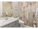 Bathroom features a white vanity with a modern sink and toilet at 731 Glowing Horizon St, Henderson, NV 89052