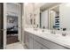 Bright bathroom with double sinks and modern fixtures, open to bedroom at 731 Glowing Horizon St, Henderson, NV 89052
