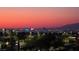 Stunning skyline view of the Las Vegas strip during sunset with palm trees in the foreground at 731 Glowing Horizon St, Henderson, NV 89052