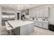 Eat-in kitchen with stainless appliances, quartz countertops and counter seating for four people at 731 Glowing Horizon St, Henderson, NV 89052